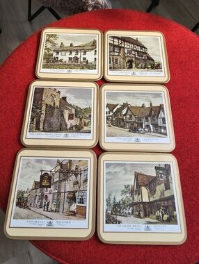 Vintage set of Pimpernel cork-backed coasters featuring scenes of English inns